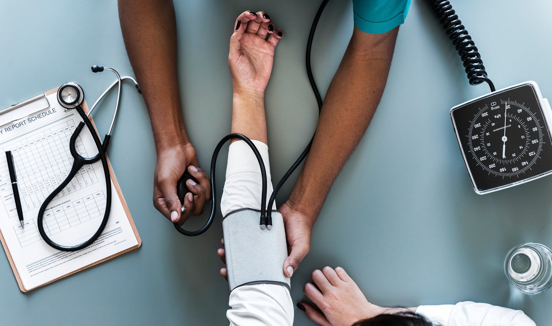 Stock photograph of a clinician taking a patient's blood-pressure reading